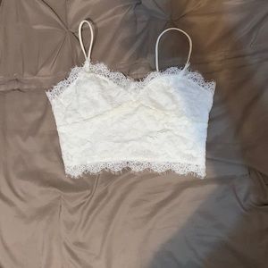 A white crop top from pretty little things.
